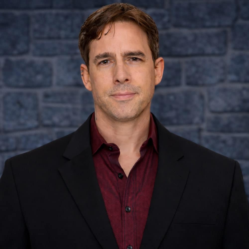 KellyEros-Headshot-AlchemyIT-2026-01-min